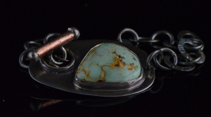 silver bracelet with gold kumbo leaf