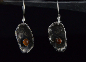 silver earrings with a lot of gold